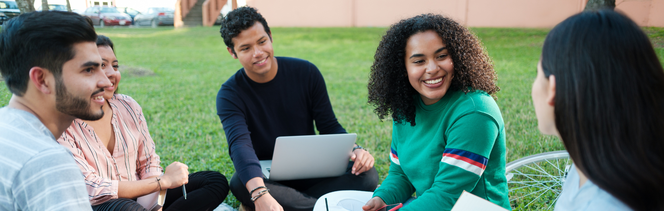 group sitting in grass