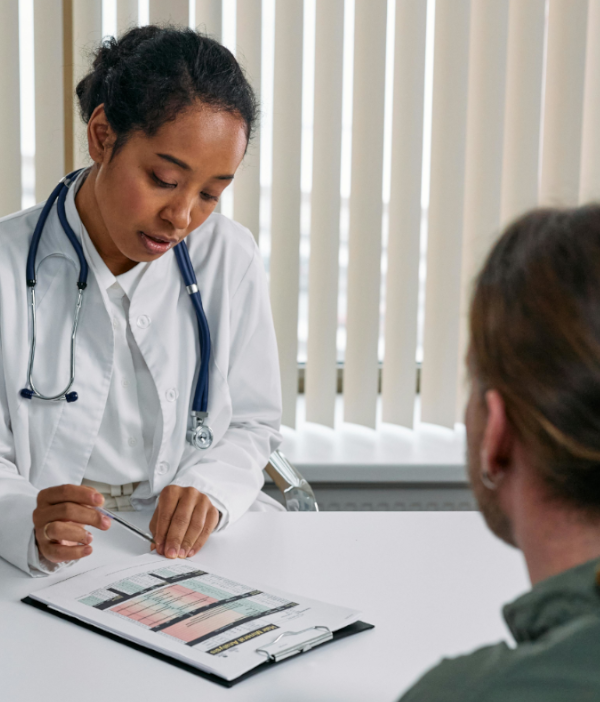 opioid-abuse-resources doctor reading chart in front of patient