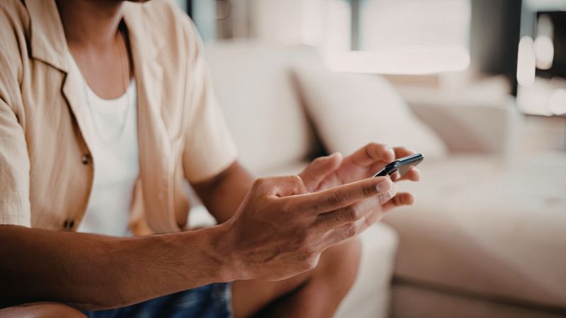 man holding cell phone